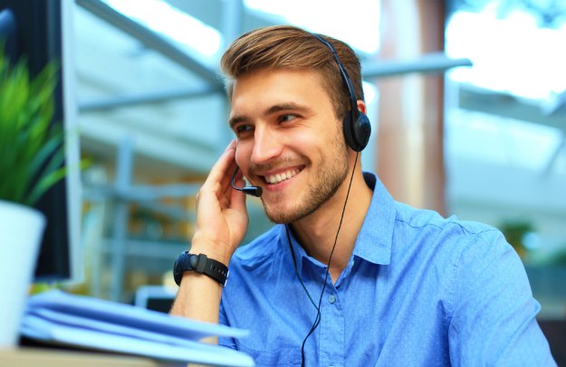 smiling friendly handsome young male call | Be More Assumptive In A Sales Call With These Tips | closing the deal