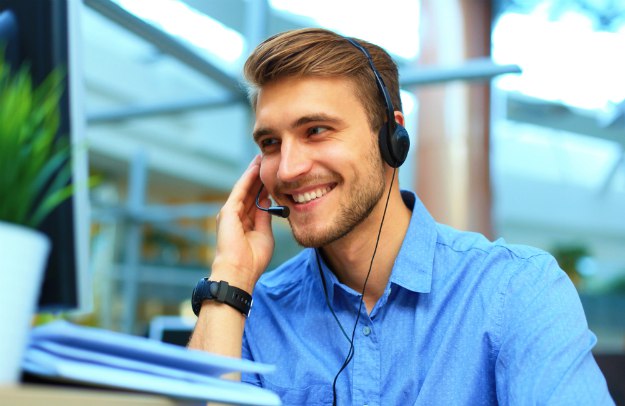 smiling friendly handsome young male call making notes | Proven Follow Up Techniques to Close The Sale | sales follow up