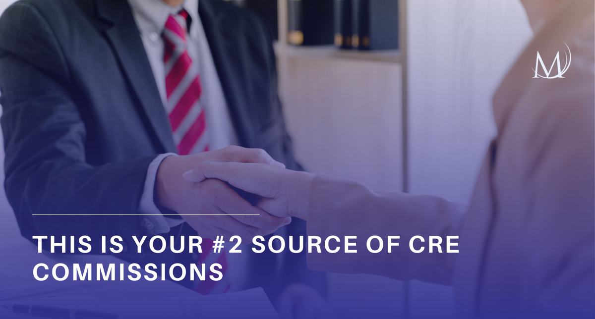 Close-up of two people in business attire shaking hands in a brightly lit office setting, overlayed with a blue gradient background. A white logo featuring a stylized "M" is in the top right corner, and large white text at the bottom reads, "THIS IS YOUR #2 SOURCE OF CRE COMMISSIONS."