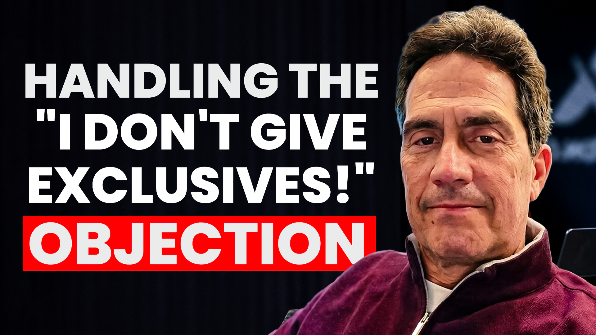 Close-up portrait of a man with dark, styled hair, looking directly into the camera with a neutral expression. To his left, bold text on a dark background reads, "HANDLING THE 'I DON'T GIVE EXCLUSIVES!' OBJECTION," with the word "OBJECTION" highlighted in a solid red block.