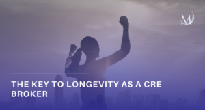 A silhouetted person standing on top of a mountain peak against a dramatic sky, with the article headline text "The Key to Longevity as a CRE Broker" visible.