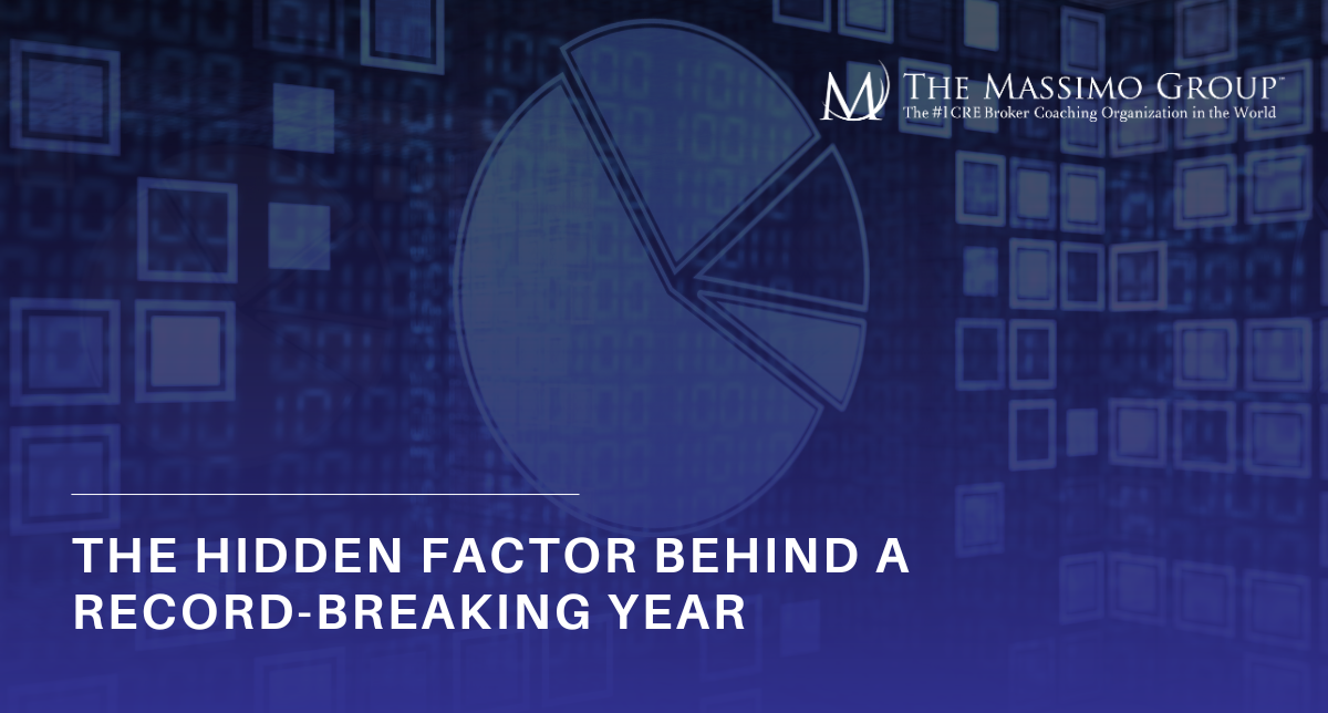 A promotional image with a dark blue and black textured background. Large, bold white and blue text reads, "The Hidden Factor Behind A Record-Breaking Year." A subtle "The Massimo Group" logo is visible in the top right corner.